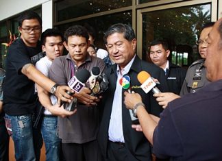 Interior Minister Chalerm Yubamrung meets the press outside a June 18 meeting at Nong Nooch Tropical Garden.